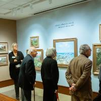 Guests admiring paintings at Friends of Alten 2018